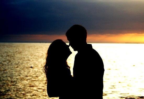 benidorm couple at sunset image