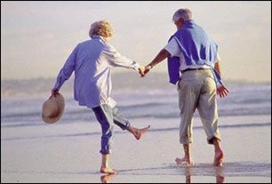 couple of pensioners on beach in benidorm image